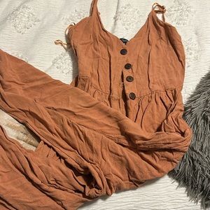 Coral jumpsuit, with 6 buttons down the front, size x-small